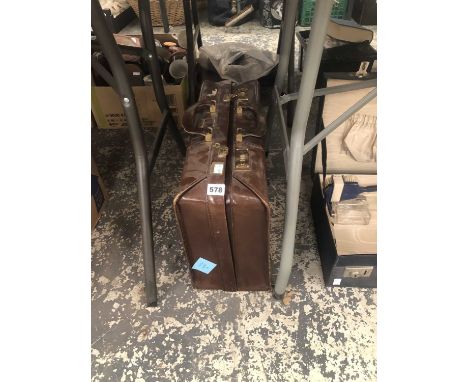 A number locking brief case together with a partly fitted vanity case