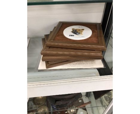A group of five leather-framed Boehm bone china David Shepherd decorated plaques.  