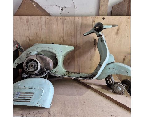 A Vintage Vespa motorcycle/scooter.