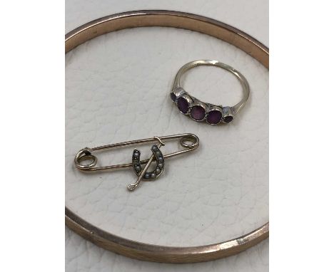 A vintage 9ct hallmarked rose gold continuous arm bangle, dated 1928, a vintage 9ct gold stamped five stone graduated gemset 