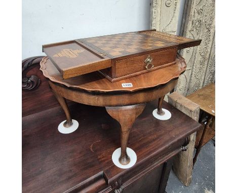 A mahogany games box inlaid inside the flap top with chess, cribbage and solitaire boards, together with a mahogany coffee ta