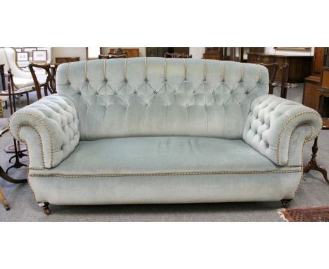 A Late Victorian Sofa, with button back and arms, 196cm by 92cm by 92cm