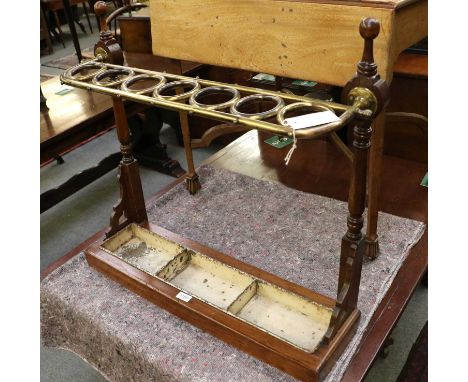 A 19th Century Brass and Mahogany Stick/Umbrella Stand, with seven ring holders, with three section metal drip tray, 75cm by 