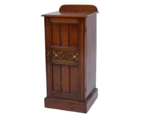 A Victorian walnut pot cupboard, the top with a raised back above a panelled door, enclosing shelf, on plinth base, 87cm high