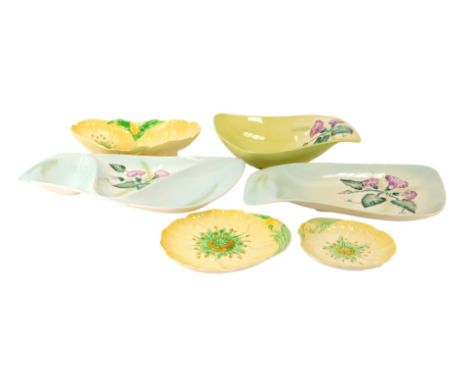 A group of Carltonware pottery, to include double flower head oval dish in yellow, green and orange, 26.5cm wide, matching fl
