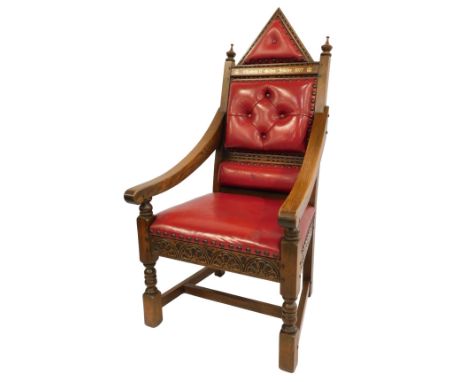 An Elizabeth II Silver Jubilee oak throne chair, with red leather upholstery, and carved and raised back, with crested and bu