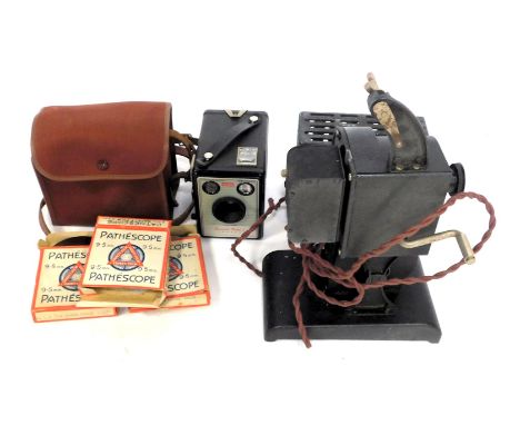 A Pathescope 9.5mm projector, together with various safety film reels, together with a Kodak Brownie Model 1 camera, and vari