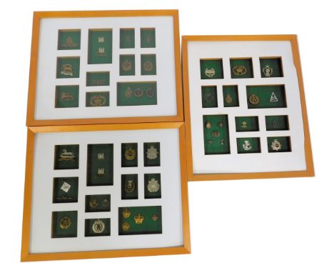 Three cap badge displays, each depicting RAF and Army badges, applique 5DGBASC, RAG and others.