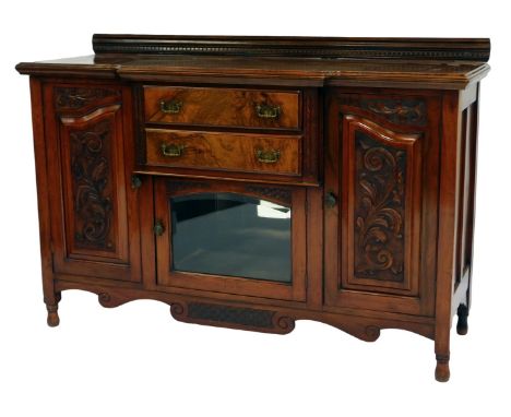 A late Victorian walnut and burr walnut break front sideboard, the top with a raised back with dentil moulding, the base with