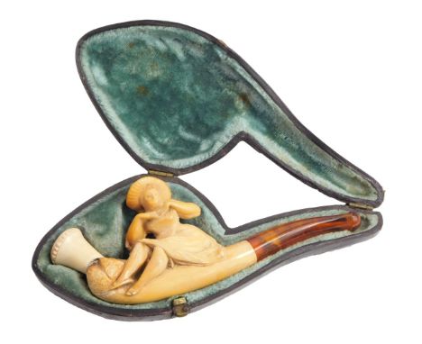 A late 19th/early 20thC meerschaum pipe, the carved meerschaum top depicting a figure perched on pipe with an amber cheroot, 