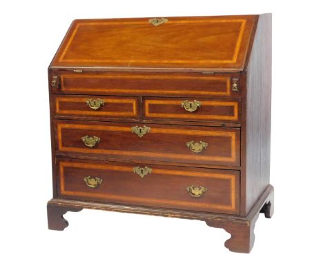 A Georgian mahogany and satinwood cross banded bureau, the fall enclosing an arrangement of drawers, cupboard and recesses, o