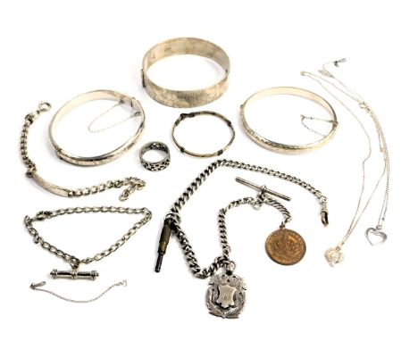 A group of silver and other jewellery, comprising three silver bangles, a silver watch chain with draughts crest, various whi