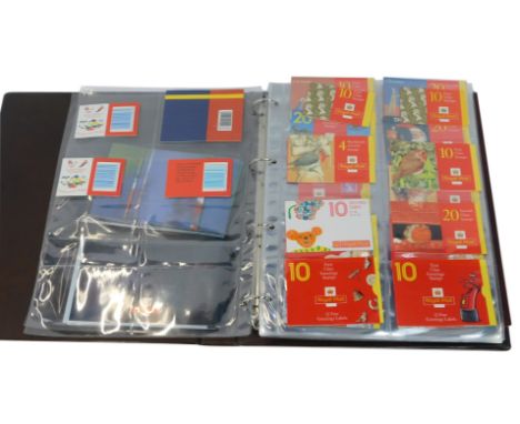 An album of Royal Mail universal stamps, to include selection of second class commemorative Christmas stamps, Worldwide Airma