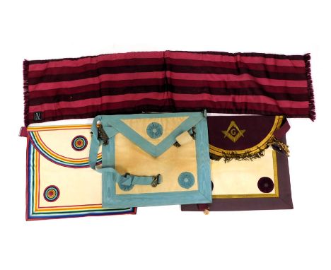A Masonic regalia apron and sash, with multi coloured rosette. 