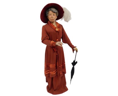 A mannequin modelled as Emmeline Pankhurst, wearing red velvet dress and hat, the plaster mannequin 174cm high. (AF) 