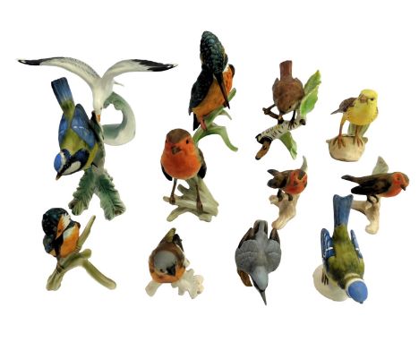 A group of Goebel matt porcelain birds, to include a kingfisher on a branch, 18cm high, seagull riding a wave, 12cm high, rob