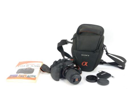 A Sony A200 digital camera, together with a 1.3ft macro lens, charging cable, manual, etc. 