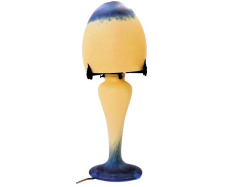 A French Art Deco style mushroom lamp, in mottled dark blue and cream colourway, the mushroom shaped shade resting on three m
