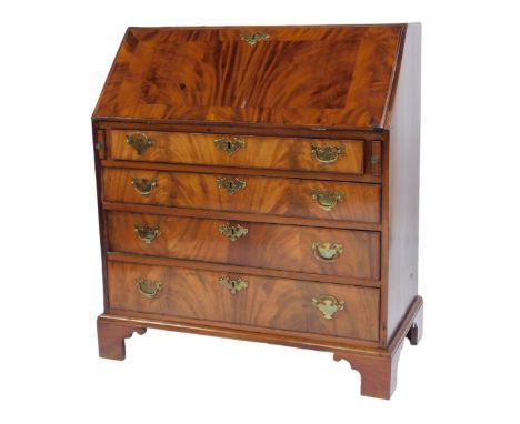 A George III flame mahogany bureau, the fall enclosing an arrangement of recess and drawers, the base with four drawers, on b