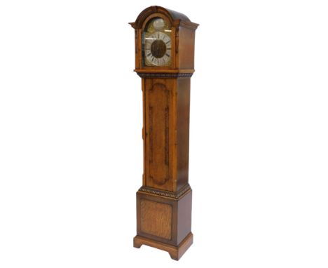 An early 20thC oak cased longcase clock, the brass break arch dial with silvered chapter ring, bearing Roman numerals, below 