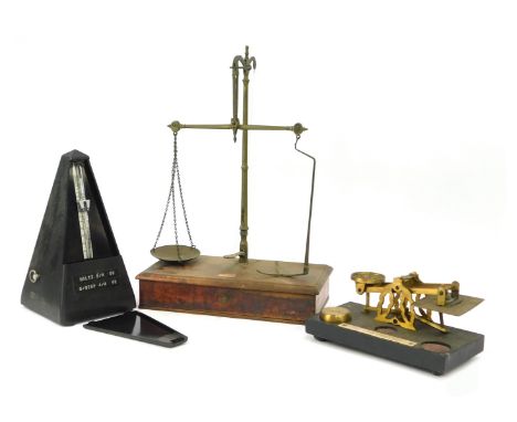 A set of 19thC brass postage scales, on an ebonised base, bearing plaque, with one weight, 20cm wide, together with Jaccard m