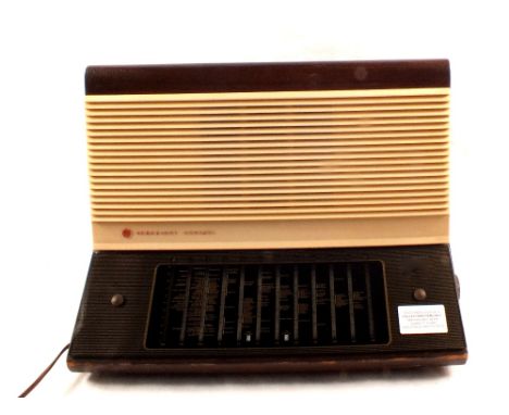 A Pye wood and Bakelite mains radio (collectors item only) plus a sewing machine