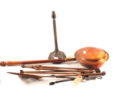 A Victorian copper warming pan, table lamp and fire irons