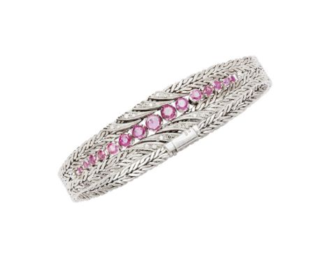 A ruby and diamond set braceletclaw set with fifteen graduated round cut rubies, with small round cut diamond detail above an
