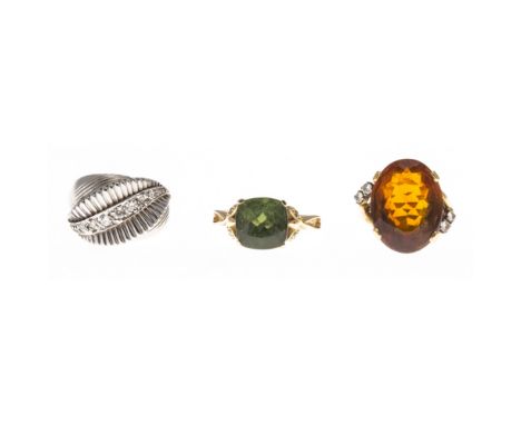 Three gem set ringsto include a 1940s 9ct gold ring, of domed ribbed design, set with a single row of graduated round brillia