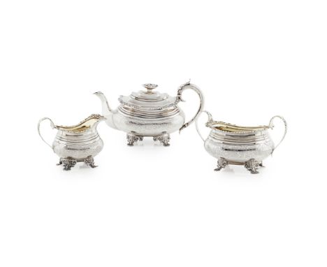 A matched early 19th century three piece tea serviceLondon 1820s, comprising of a teapot, a twin handled sugar basin, and a m