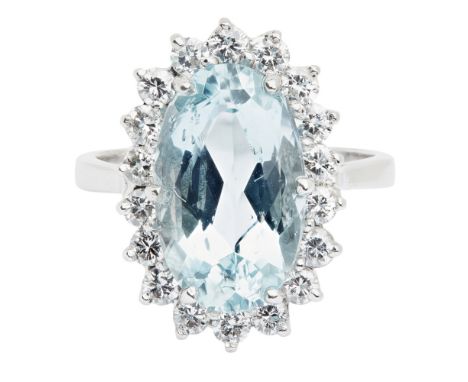 An aquamarine and diamond set cluster ringclaw set with an oval cut aquamarine, in a border of round brilliant cut diamonds, 