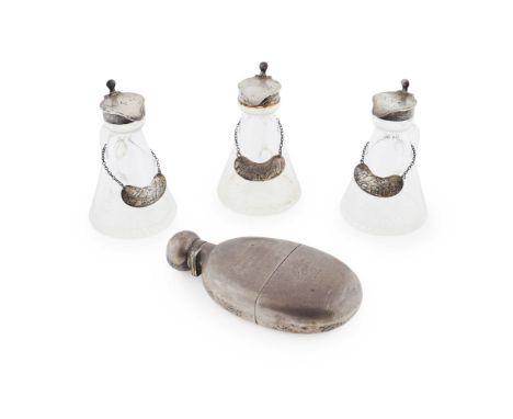 A group of three silver mounted whisky nogginsRWR, London 1934, of conventional form hinged covers engraved initials and with