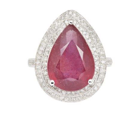 A ruby and diamond set cocktail ringclaw set with a pear shaped ruby in a double border of eight cut diamonds, the shoulders 