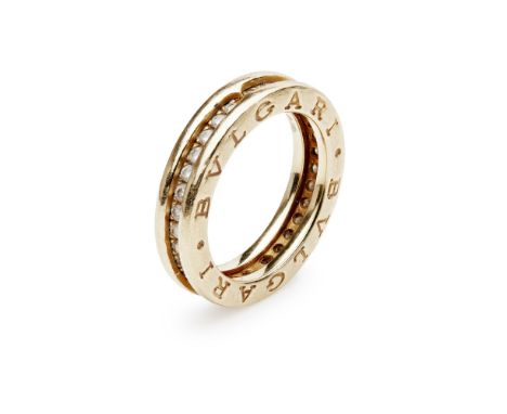 BULGARI - A BZero1 diamond set ringclaw set with a row of round cut diamonds, the raised band engraved with BVLGARI, stamped 