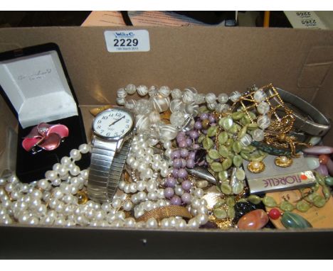 A quantity of costume jewellery beads, bangles, etc, and a large Timex Wristwatch