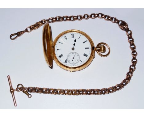 An 18ct Gold cased Half Hunter Pocket Watch having crown wound movement, the white enamelled face with Roman numerals and ins