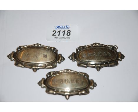 Three white metal Decanter Labels.