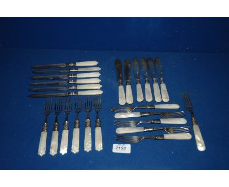 A quantity of silver bladed Fish Knives and forks, along with a quantity of Epns Knives and Forks, all with Mother of Pearl h