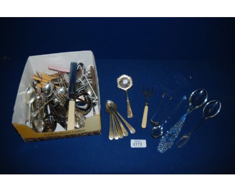 A quantity of plated cutlery including pickle fork, mustard spoons, teaspoons, sugar tongs, etc.