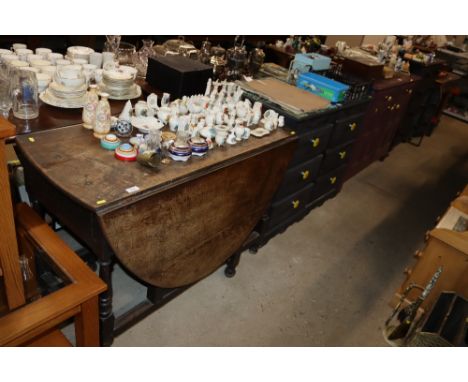 An antique oak gate leg table 