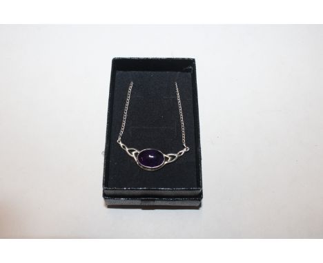 A vintage Celtic style Sterling silver and cabochon amethyst necklace 