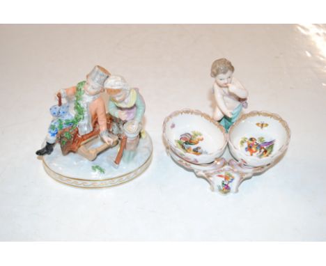 A Dresden porcelain figure group and a continental porcelain salt decorated with cherub