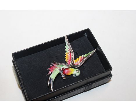 A vintage marcasite and enamelled silver parrot brooch