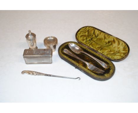 A cased silver fork and spoon, 66gms; a white metal pepper pot; a silver pepper pot; a silver handled button hook and a silve