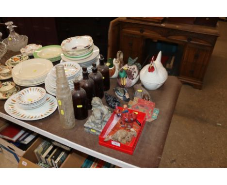 A collection of old glass bottles to include Esso Lube bottle, various duck ornaments, clockwork toy bucking bronco and anoth