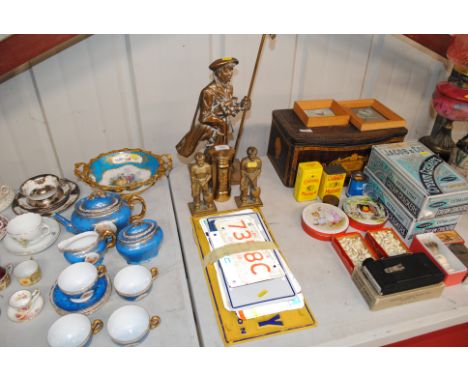 A brass companion stand in the form of a golf caddy; two brass figures; a brass money box in the form of a letterbox and a co