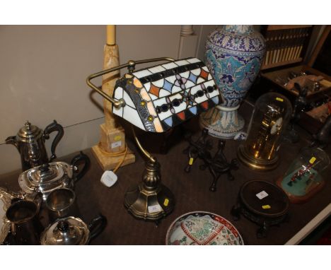 A desk lamp with Tiffany style shade 