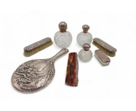 A collection of silver including a hand mirror by William Adam, Birmingham, with cast decoration of flowers, three silver-lid