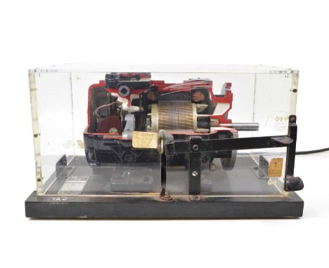 Cutaway model of an AC electric motor in a perspex presentation case. 44cm (17.5") wide, 27cm (10.5") deep, 23.5cm (9") high.