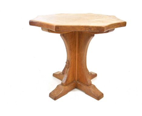 A Robert Thompson of Kilburn, Mouseman oak occasional table, with an octagonal top on cruciform support with mouse motif to l